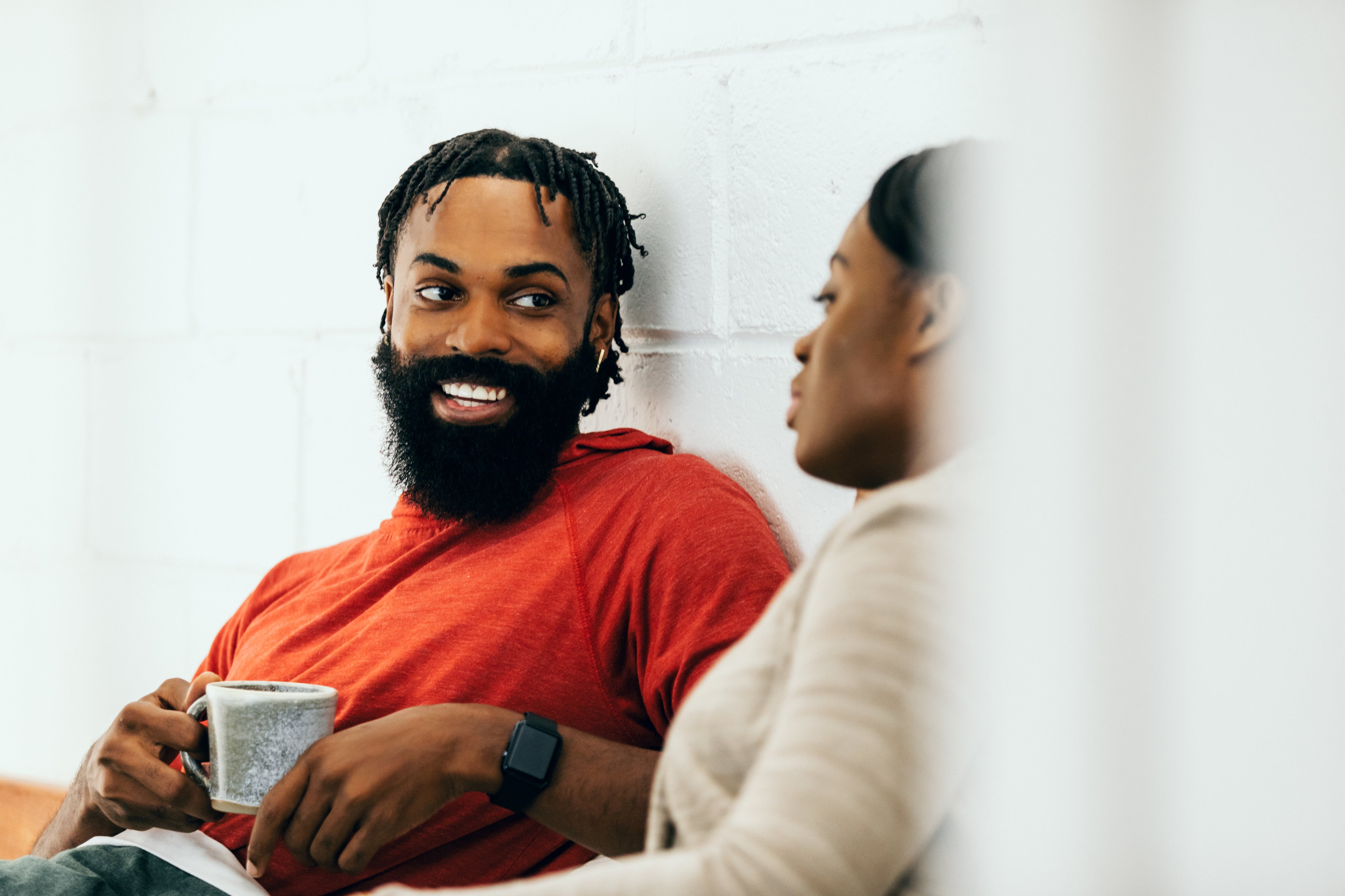 files/smiling-man-holds-cup-of-tea.jpg